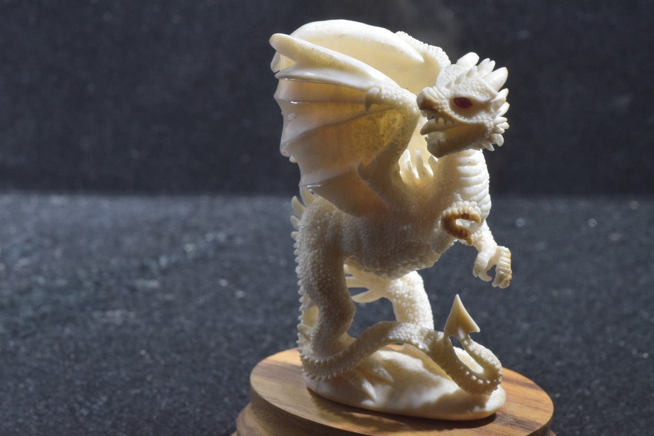 Fossilized Mammoth Tusk Ivory Carved Dragon With Ruby Eyes On An Oak Wooden Base